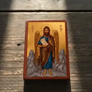 Saint John the Forerunner Byzantine wooden icon shown at an angle on a rustic wooden surface