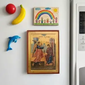 Annunciation of Theotokos Byzantine wooden-mounted icon with magnet displayed on a refrigerator