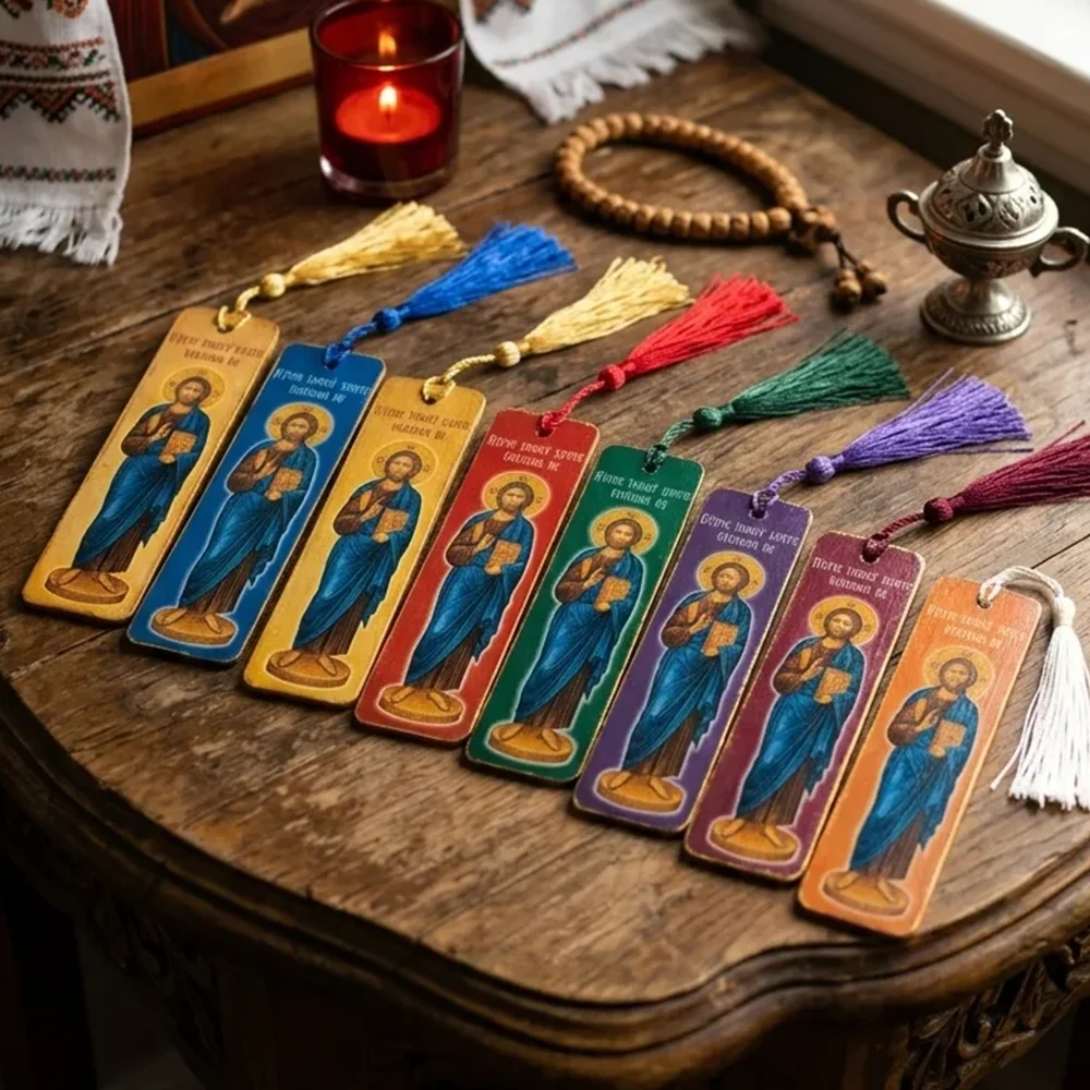 Set of 8 Lord Jesus Christ Wooden Bible Bookmarks A vibrant set of 8 handcrafted wooden Bible bookmarks featuring the Orthodox icon of Jesus Christ and silken tassels, resting on a wooden table.